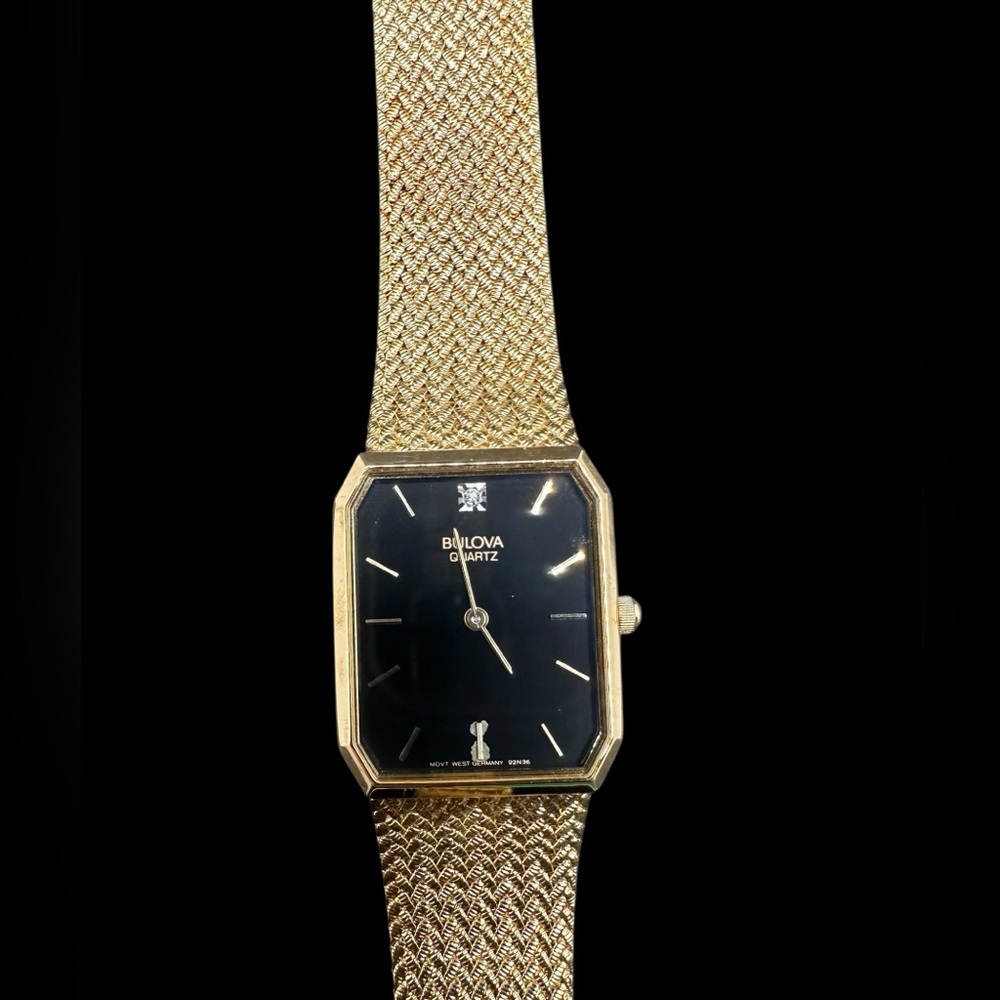 Bulova Gold and Black Rectangular Men's Dress Watch. Discoloration at 6 hr mark